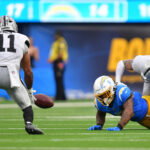 Sep 20, 2026; Inglewood, California, USA; Las Vegas Raiders safety Jeremy Chinn (11) recovers a fumble against the Los Angeles Chargers during the second half at SoFi Stadium. Mandatory Credit: Gary A. Vasquez-Imagn Images