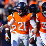Sep 20, 2026; Denver, Colorado, USA; Denver Broncos cornerback Riley Moss (21) celebrates an interception against the Jacksonville Jaguars during the fourth quarter at Empower Field at Mile High. Mandatory Credit: Ron Chenoy-Imagn Images
