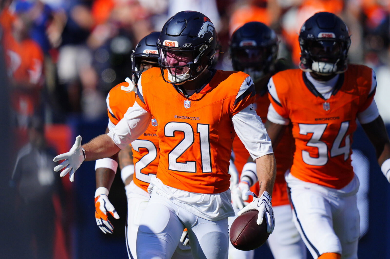 Sep 20, 2026; Denver, Colorado, USA; Denver Broncos cornerback Riley Moss (21) celebrates an interception against the Jacksonville Jaguars during the fourth quarter at Empower Field at Mile High. Mandatory Credit: Ron Chenoy-Imagn Images