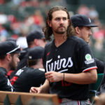 Sep 20, 2026; Anaheim, California, USA; Minnesota Twins pitcher Dean Kremer (13) looks on in the dugout during the seventh inning against the Los Angeles Angels at Angel Stadium. Mandatory Credit: Kiyoshi Mio-Imagn Images