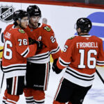 Sep 21, 2026; Chicago, Illinois, USA; Chicago Blackhawks defenseman Bowen Byram (24) celebrates with left wing Nick Lardis (76) and center Anton Frondell (16) after he scored the game winning goal during the overtime period against the Minnesota Wild at the United Center. Mandatory Credit: Matt Marton-Imagn Images