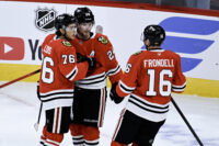 Sep 21, 2026; Chicago, Illinois, USA; Chicago Blackhawks defenseman Bowen Byram (24) celebrates with left wing Nick Lardis (76) and center Anton Frondell (16) after he scored the game winning goal during the overtime period against the Minnesota Wild at the United Center. Mandatory Credit: Matt Marton-Imagn Images