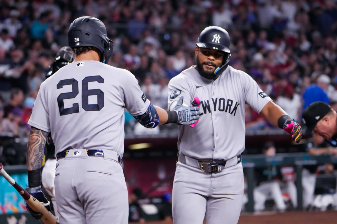 Sep 20, 2026; Phoenix, Arizona, USA; New York Yankees left fielder Heliot Ramos (34) celebrates his home run with first baseman Luis García Jr. (26) during the third inning during the game against Arizona Diamondbacks at Chase Field. Mandatory Credit: Arianna Grainey-Imagn Images