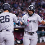 Sep 20, 2026; Phoenix, Arizona, USA; New York Yankees left fielder Heliot Ramos (34) celebrates his home run with first baseman Luis García Jr. (26) during the third inning during the game against Arizona Diamondbacks at Chase Field. Mandatory Credit: Arianna Grainey-Imagn Images