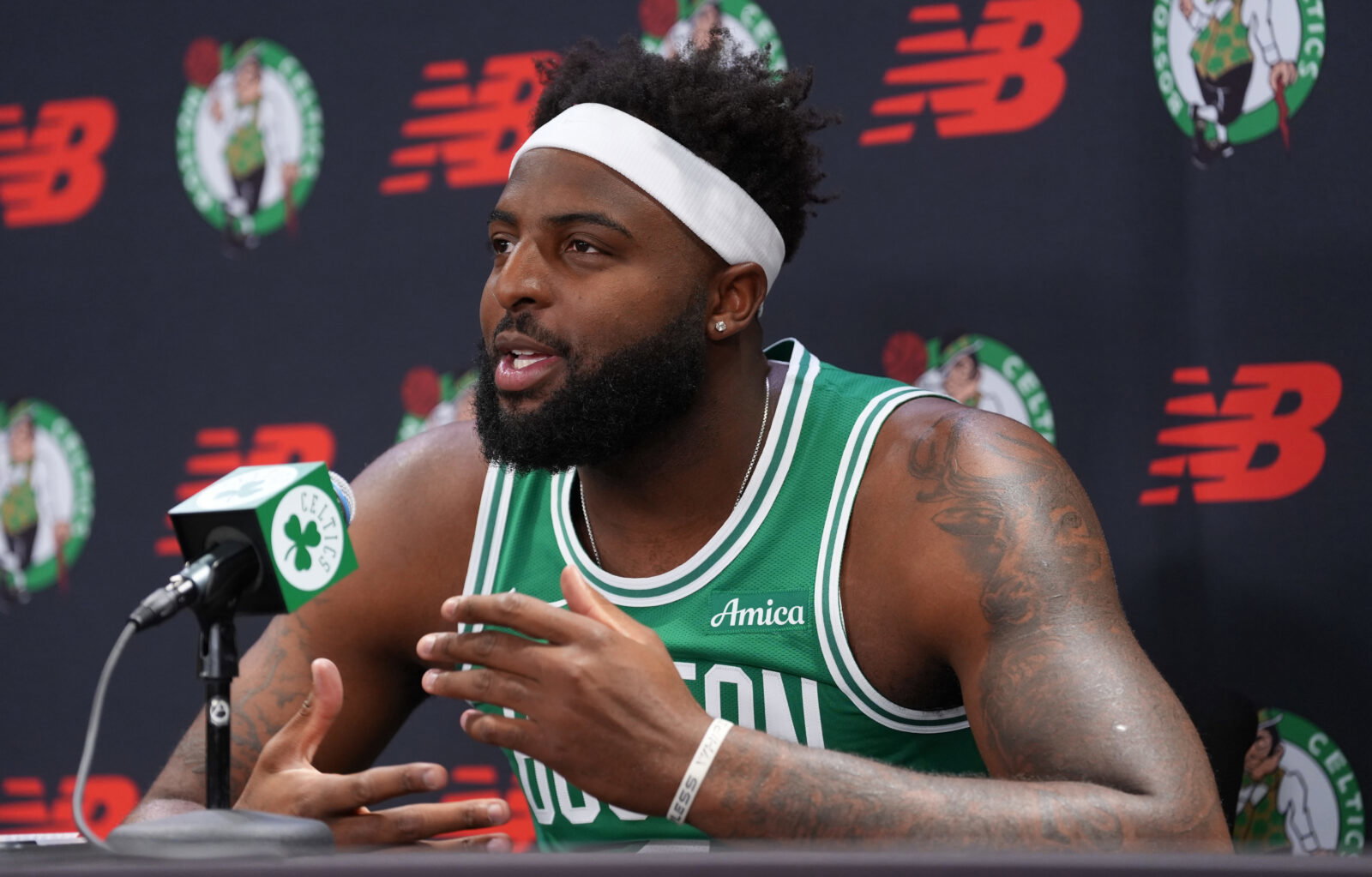 Sep 28, 2026; Boston, MA, USA; Boston Celtics center Mitchell Robinson (4) talks to reporters during media day at Auerbach Center. Mandatory Credit: