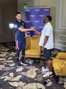 Vincent Goodwill gets ready to interview Steph Curry, who was playing for Team USA.