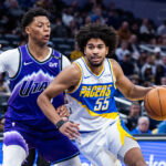Feb 3, 2026; Indianapolis, Indiana, USA; Indiana Pacers guard Ethan Thompson (55) dribbles the ball while Utah Jazz forward Ace Bailey (19) defends in the second half at Gainbridge Fieldhouse. Mandatory Credit: Trevor Ruszkowski-Imagn Images