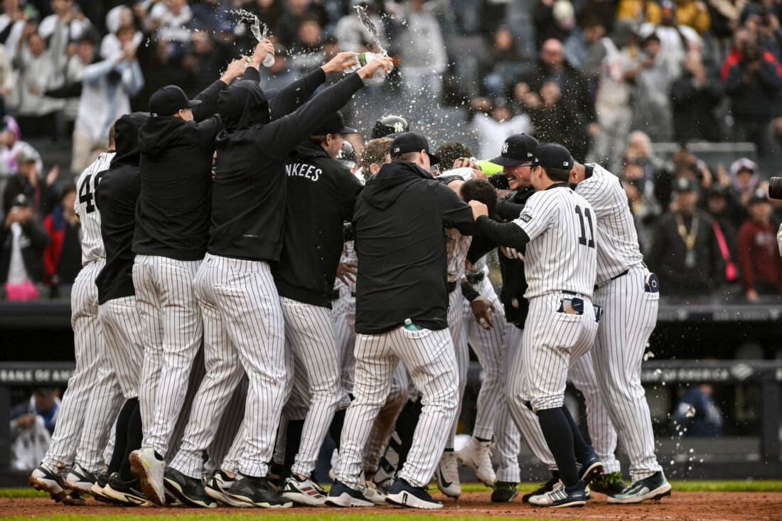 May 24, 2026; Bronx, New York, USA; New York Yankees right fielder Aaron Judge (99) celebrates with teammates after hitting a walk off two run home run against the Tampa Bay Rays during the ninth inning at Yankee Stadium. Mandatory Credit: John Jones-Imagn Images