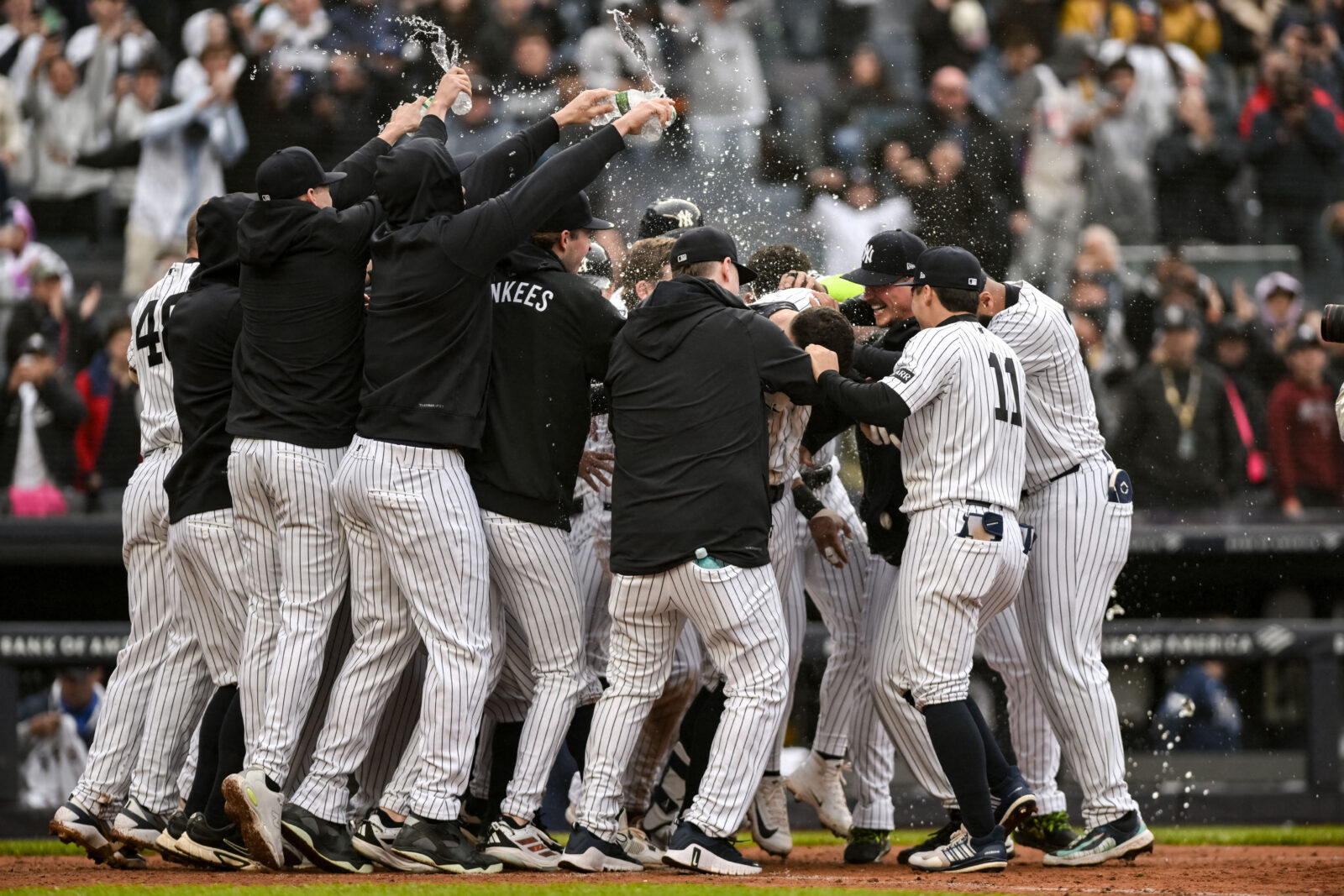 May 24, 2026; Bronx, New York, USA; New York Yankees right fielder Aaron Judge (99) celebrates with teammates after hitting a walk off two run home run against the Tampa Bay Rays during the ninth inning at Yankee Stadium. Mandatory Credit: John Jones-Imagn Images