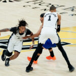 Jun 13, 2026; San Antonio, Texas, USA; San Antonio Spurs guard Stephon Castle (5) dribbles around a screen from San Antonio Spurs forward Victor Wembanyama (1) against New York Knicks guard Josh Hart (3) in the second half during game five of the 2026 NBA Finals at Frost Bank Center. Mandatory Credit: Scott Wachter-Imagn Images