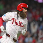 Sep 22, 2026; Philadelphia, Pennsylvania, USA; Philadelphia Phillies left fielder Brandon Marsh (16) watches his two-run home run during the second inning against the Milwaukee Brewers at Citizens Bank Park. Mandatory Credit: Eric Hartline-Imagn Images