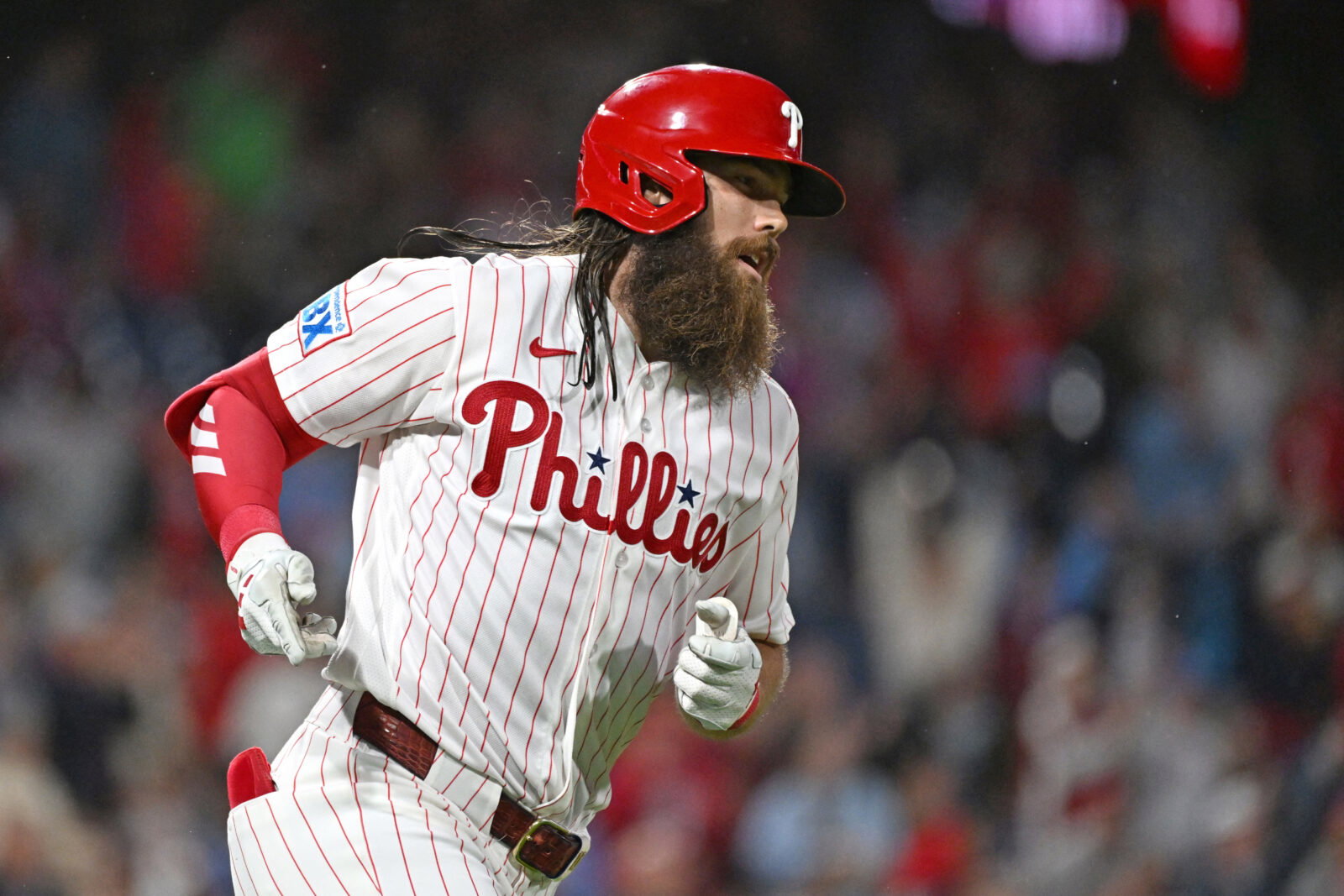 Sep 22, 2026; Philadelphia, Pennsylvania, USA; Philadelphia Phillies left fielder Brandon Marsh (16) watches his two-run home run during the second inning against the Milwaukee Brewers at Citizens Bank Park. Mandatory Credit: Eric Hartline-Imagn Images