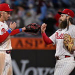 Sep 22, 2026; Philadelphia, Pennsylvania, USA; Philadelphia Phillies second baseman Bryson Stott (5) and left fielder Brandon Marsh (16) celebrate win against the Milwaukee Brewers at Citizens Bank Park. Mandatory Credit: Eric Hartline-Imagn Images