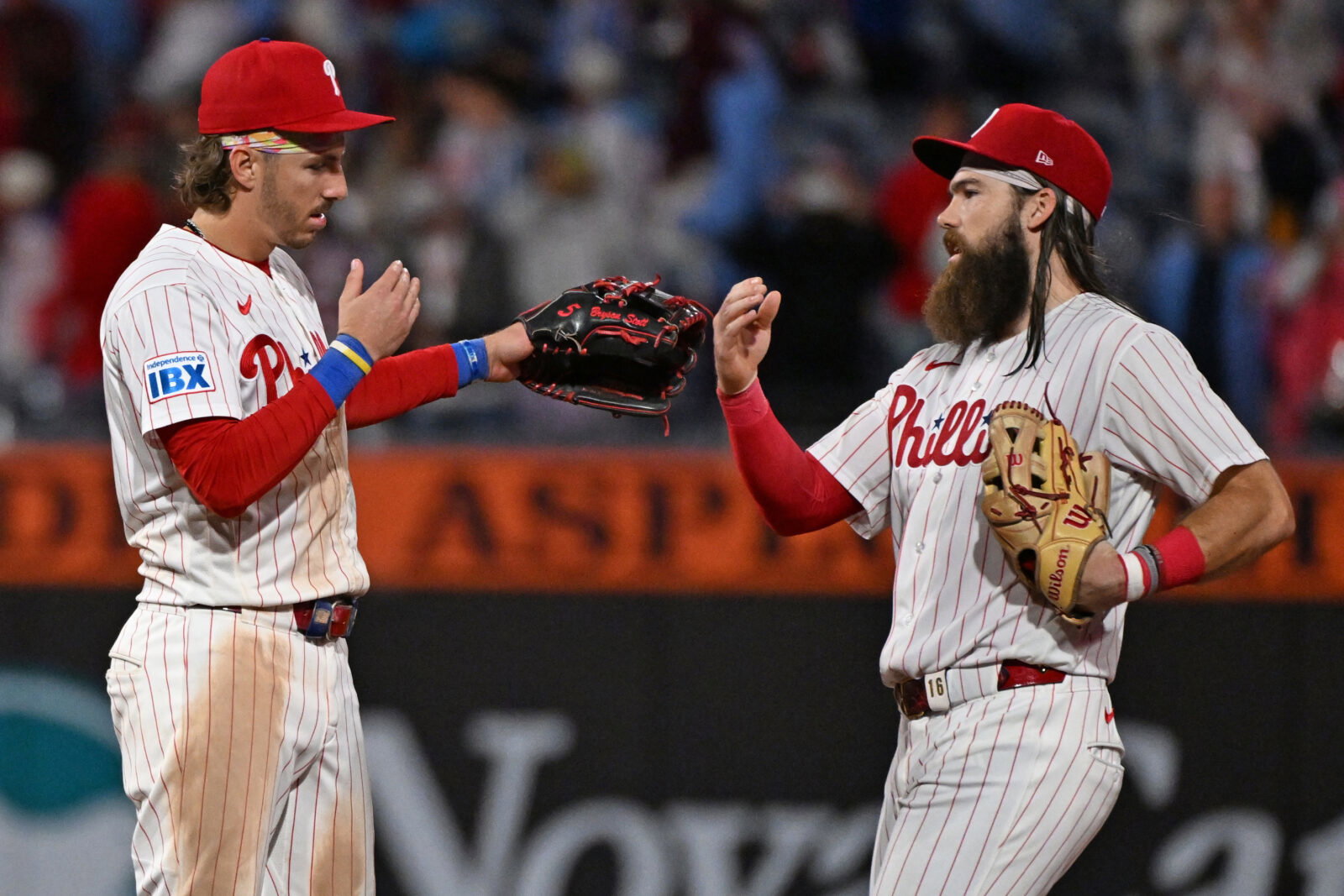 Sep 22, 2026; Philadelphia, Pennsylvania, USA; Philadelphia Phillies second baseman Bryson Stott (5) and left fielder Brandon Marsh (16) celebrate win against the Milwaukee Brewers at Citizens Bank Park. Mandatory Credit: Eric Hartline-Imagn Images