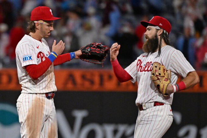 Sep 22, 2026; Philadelphia, Pennsylvania, USA; Philadelphia Phillies second baseman Bryson Stott (5) and left fielder Brandon Marsh (16) celebrate win against the Milwaukee Brewers at Citizens Bank Park. Mandatory Credit: Eric Hartline-Imagn Images