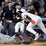 Sep 24, 2026; Bronx, New York, USA; New York Yankees shortstop George Lombard Jr. (96) scores a run against Tampa Bay Rays catcher Liam Hicks (34) on a wild pitch during the seventh inning at Yankee Stadium. Mandatory Credit: Brad Penner-Imagn Images TPX IMAGES OF THE DAY