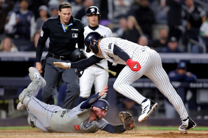 Sep 24, 2026; Bronx, New York, USA; New York Yankees shortstop George Lombard Jr. (96) scores a run against Tampa Bay Rays catcher Liam Hicks (34) on a wild pitch during the seventh inning at Yankee Stadium. Mandatory Credit: Brad Penner-Imagn Images TPX IMAGES OF THE DAY