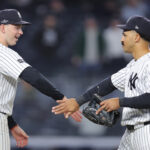 Sep 29, 2026; Bronx, New York, USA; New York Yankees designated hitter Ben Rice (22) and outfielder Trent Grisham (12) celebrate after defeating the Boston Red Sox in game one of the Wildcard round for the 2026 MLB Playoffs at Yankee Stadium. Mandatory Credit: Brad Penner-Imagn Images