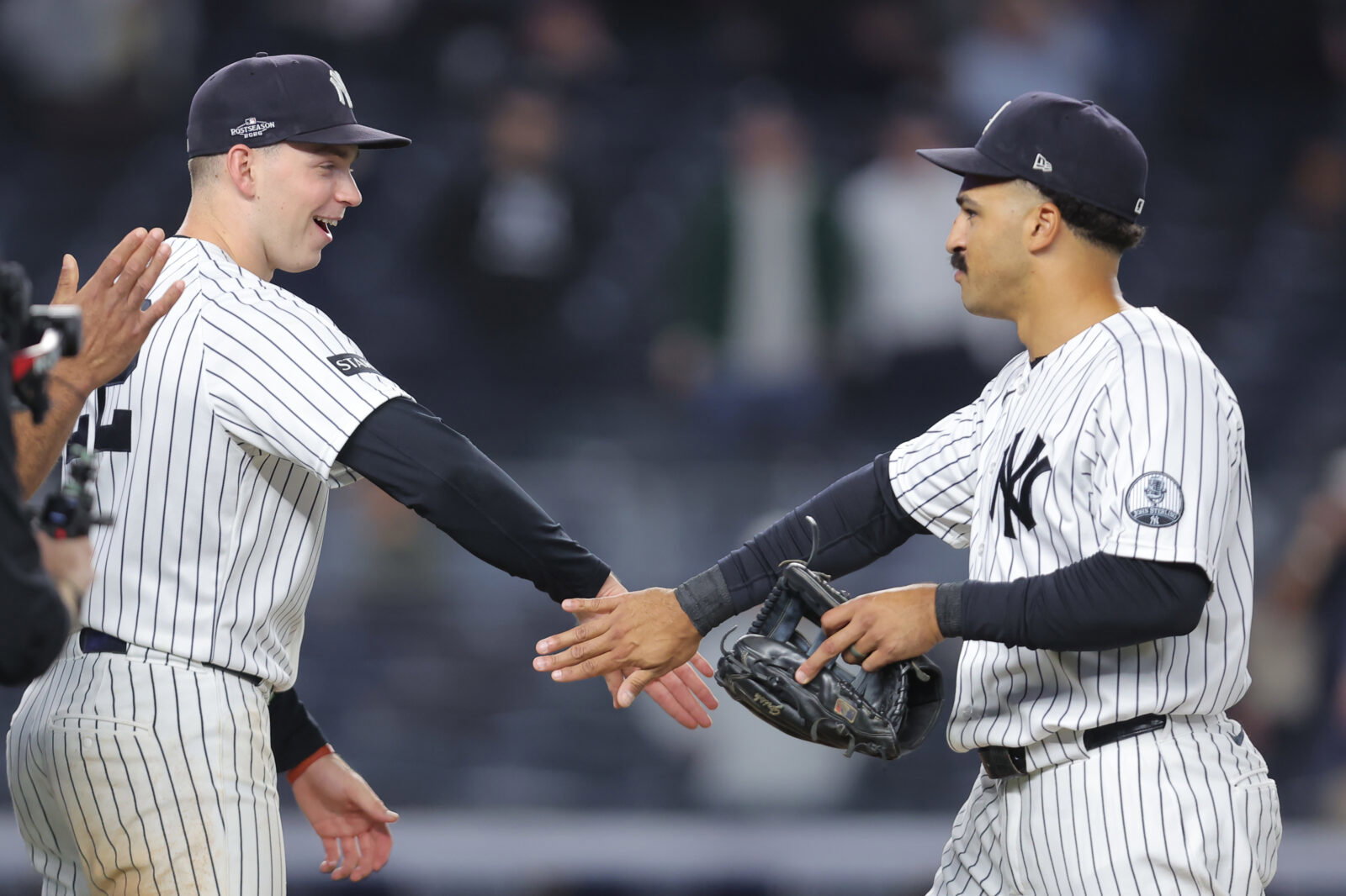Sep 29, 2026; Bronx, New York, USA; New York Yankees designated hitter Ben Rice (22) and outfielder Trent Grisham (12) celebrate after defeating the Boston Red Sox in game one of the Wildcard round for the 2026 MLB Playoffs at Yankee Stadium. Mandatory Credit: Brad Penner-Imagn Images