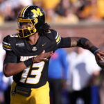 Oct 3, 2026; Columbia, Missouri, USA; Missouri Tigers quarterback Austin Simmons (13) looks to throw in the third quarter against the Florida Gators at Faurot Field at Memorial Stadium. Mandatory Credit: William Purnell-Imagn Images