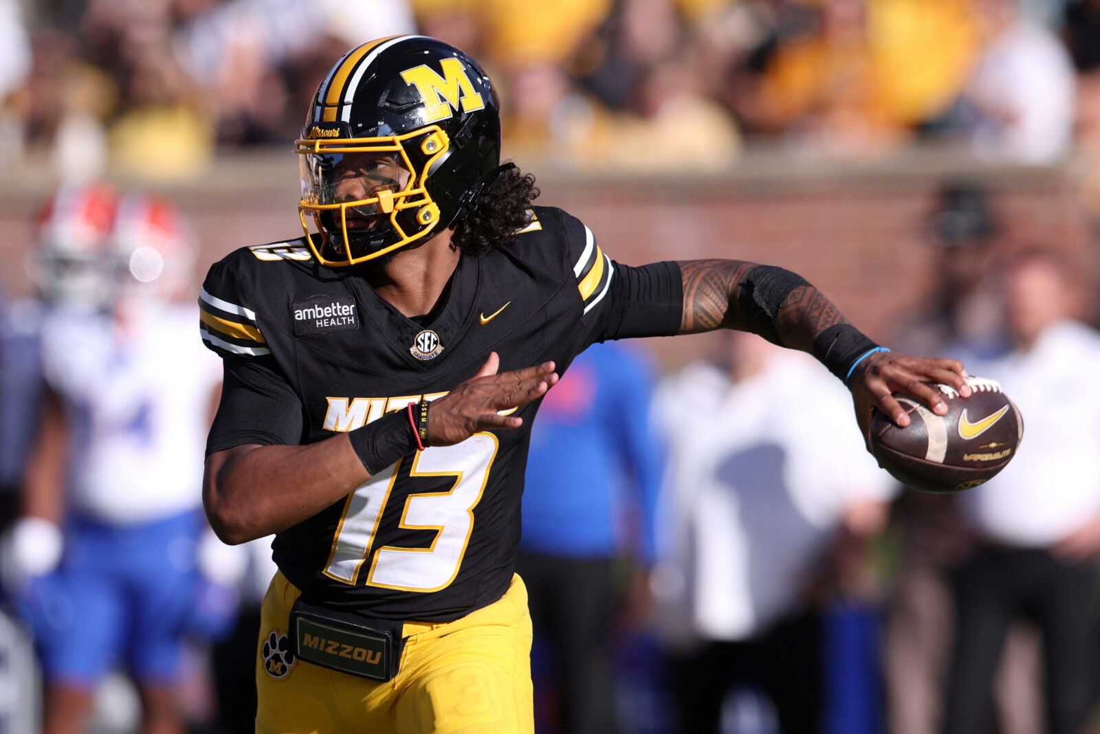 Oct 3, 2026; Columbia, Missouri, USA; Missouri Tigers quarterback Austin Simmons (13) looks to throw in the third quarter against the Florida Gators at Faurot Field at Memorial Stadium. Mandatory Credit: William Purnell-Imagn Images