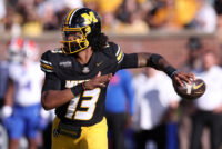 Oct 3, 2026; Columbia, Missouri, USA; Missouri Tigers quarterback Austin Simmons (13) looks to throw in the third quarter against the Florida Gators at Faurot Field at Memorial Stadium. Mandatory Credit: William Purnell-Imagn Images