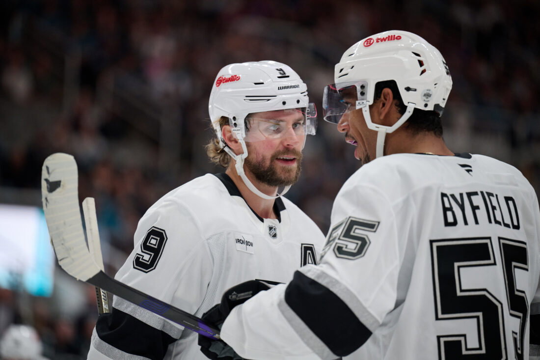 Oct 3, 2026; San Jose, California, USA; Los Angeles Kings right wing Adrian Kempe (9) chats with right wing Quinton Byfield (55) before a faceoff against the San Jose Sharks during the first period at SAP Center at San Jose. Mandatory Credit: Robert Edwards-Imagn Images