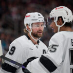 Oct 3, 2026; San Jose, California, USA; Los Angeles Kings right wing Adrian Kempe (9) chats with right wing Quinton Byfield (55) before a faceoff against the San Jose Sharks during the first period at SAP Center at San Jose. Mandatory Credit: Robert Edwards-Imagn Images