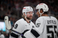Oct 3, 2026; San Jose, California, USA; Los Angeles Kings right wing Adrian Kempe (9) chats with right wing Quinton Byfield (55) before a faceoff against the San Jose Sharks during the first period at SAP Center at San Jose. Mandatory Credit: Robert Edwards-Imagn Images