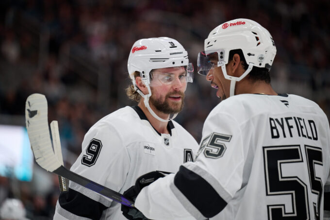 Oct 3, 2026; San Jose, California, USA; Los Angeles Kings right wing Adrian Kempe (9) chats with right wing Quinton Byfield (55) before a faceoff against the San Jose Sharks during the first period at SAP Center at San Jose. Mandatory Credit: Robert Edwards-Imagn Images