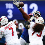 Oct 4, 2026; East Rutherford, New Jersey, USA; New York Giants defensive line Shelby Harris (93) deflects a pass as Arizona Cardinals guard Isaac Seumalo (73) blocks during the second quarter at MetLife Stadium. Mandatory Credit: Vincent Carchietta-Imagn Images