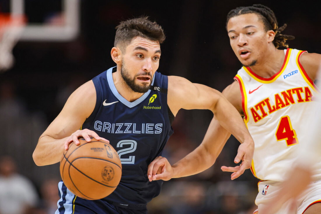 Oct 5, 2026; Atlanta, Georgia, USA; Memphis Grizzlies guard Ty Jerome (2) drives past Atlanta Hawks guard Kingston Flemings (4) in the first quarter at State Farm Arena. Mandatory Credit: Brett Davis-Imagn Images