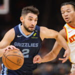 Oct 5, 2026; Atlanta, Georgia, USA; Memphis Grizzlies guard Ty Jerome (2) drives past Atlanta Hawks guard Kingston Flemings (4) in the first quarter at State Farm Arena. Mandatory Credit: Brett Davis-Imagn Images