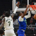 Oct 5, 2026; Milwaukee, Wisconsin, USA; Minnesota Timberwolves forward Jonathan Kuminga (24) dunks a basket against Milwaukee Bucks guard Kevin Porter (7) in the second quarter at Fiserv Forum. Mandatory Credit: Benny Sieu-Imagn Images