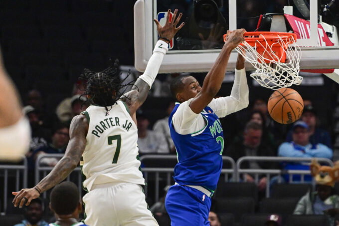 Oct 5, 2026; Milwaukee, Wisconsin, USA; Minnesota Timberwolves forward Jonathan Kuminga (24) dunks a basket against Milwaukee Bucks guard Kevin Porter (7) in the second quarter at Fiserv Forum. Mandatory Credit: Benny Sieu-Imagn Images