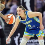 Oct 2, 2026; San Francisco, California, USA; Dallas Wings guard Paige Bueckers (5) defends against Golden State Valkyries forward Gabby Williams (left) during the fourth quarter of game three of the first round for the 2026 WNBA Playoffs at Chase Center. Mandatory Credit: Darren Yamashita-Imagn Images