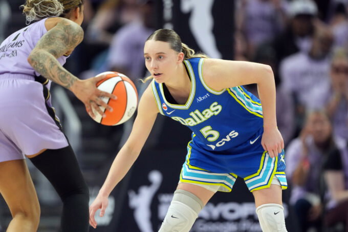 Oct 2, 2026; San Francisco, California, USA; Dallas Wings guard Paige Bueckers (5) defends against Golden State Valkyries forward Gabby Williams (left) during the fourth quarter of game three of the first round for the 2026 WNBA Playoffs at Chase Center. Mandatory Credit: Darren Yamashita-Imagn Images