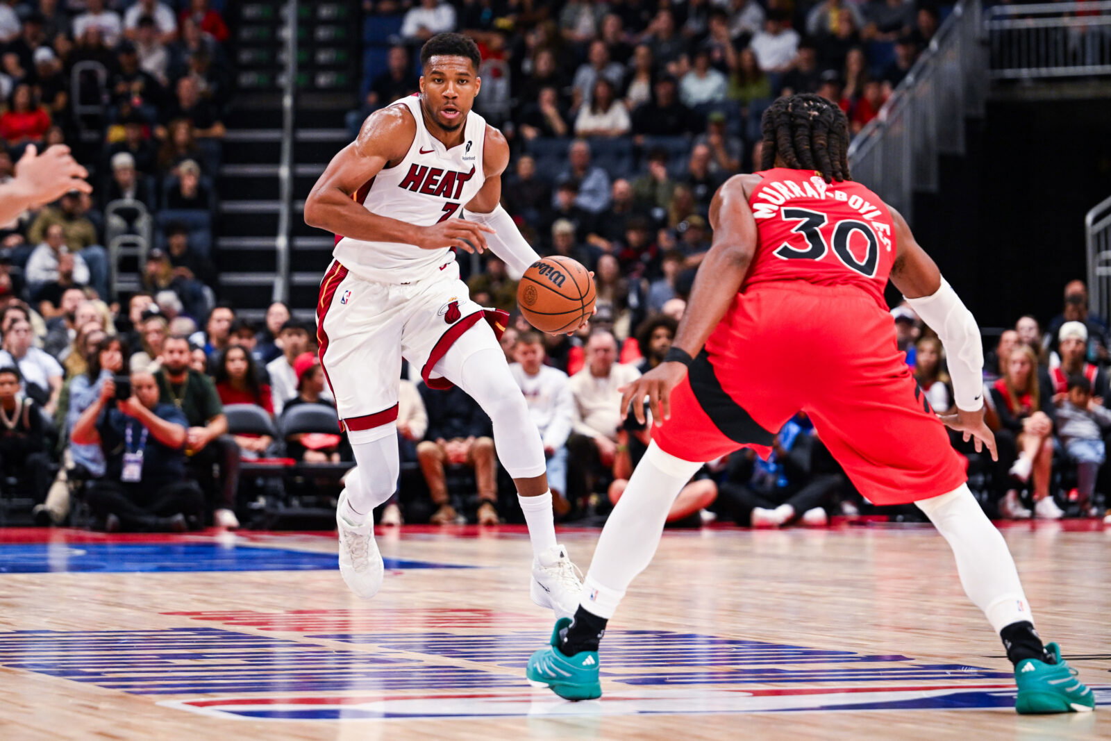 Oct 3, 2026; Quebec City, Quebec, CAN; Miami Heat forward Giannis Antetokounmpo (7) dribbles the ball against the Toronto Raptors during the second quarter at Videotron Centre. Mandatory Credit: David Kirouac-Imagn Images