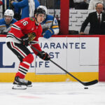 Oct 6, 2026; Chicago, Illinois, USA; Chicago Blackhawks center Anton Frondell (16) moves the puck against the St. Louis Blues during the first period at United Center. Mandatory Credit: Matt Marton-Imagn Images