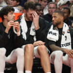 Oct 7, 2026; Portland, Oregon, USA; Portland Trail Blazers forward Deni Avdija (8), center Donovan Clingan (23) and guard Damian Lillard (0) sit ion the bench during the second half against the Golden State Warriors at Moda Center. Mandatory Credit: Jaime Valdez-Imagn Images