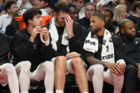 Oct 7, 2026; Portland, Oregon, USA; Portland Trail Blazers forward Deni Avdija (8), center Donovan Clingan (23) and guard Damian Lillard (0) sit ion the bench during the second half against the Golden State Warriors at Moda Center. Mandatory Credit: Jaime Valdez-Imagn Images