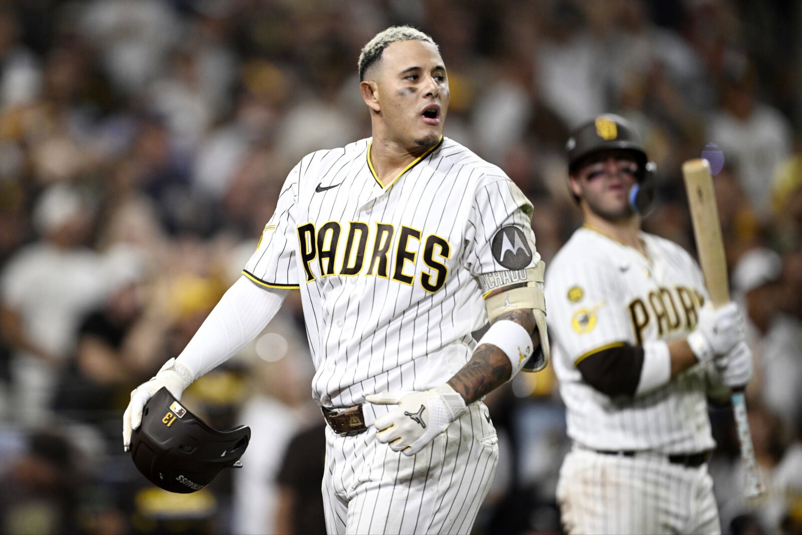 Oct 7, 2026; San Diego, California, USA; San Diego Padres third baseman Manny Machado (13) reacts after hitting a fly ball that was caught at the wall during the eighth inning against the Milwaukee Brewers in game four of the NLDS for the 2026 MLB Playoffs at Petco Park. Mandatory Credit: Denis Poroy-Imagn Images