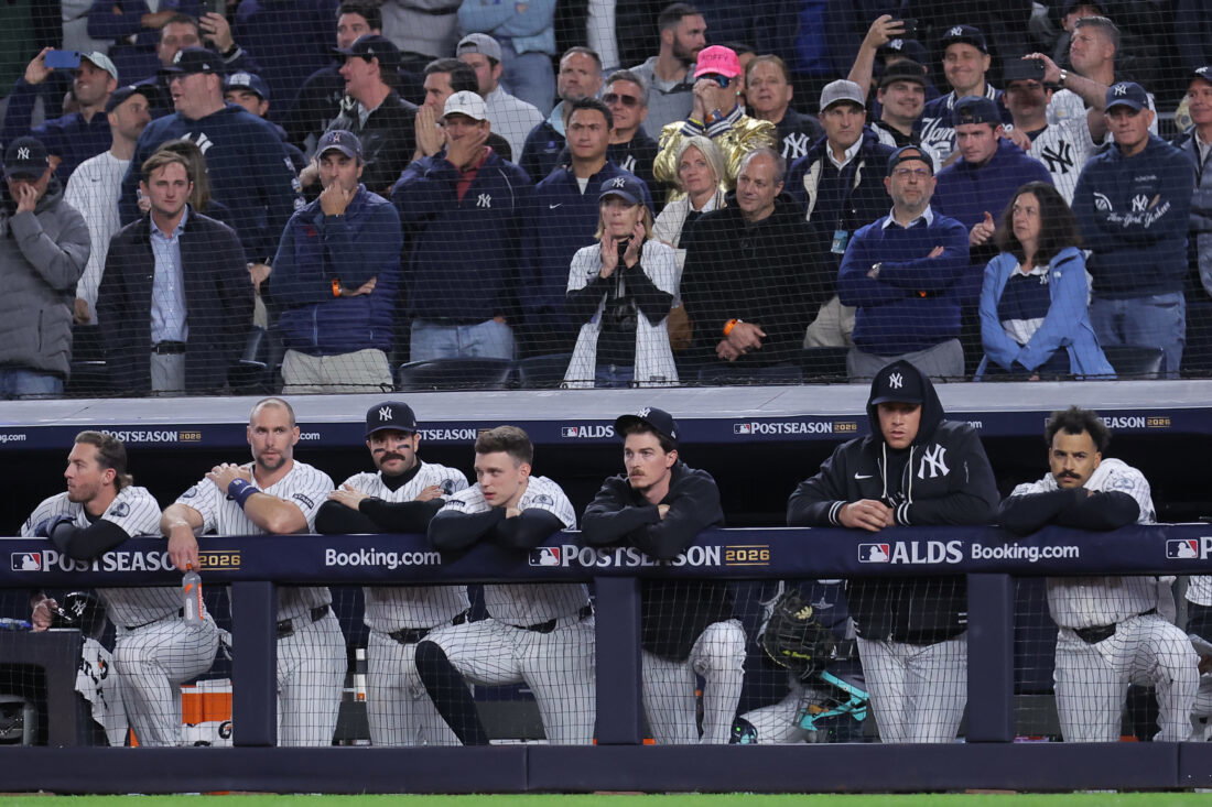 Oct 7, 2026; Bronx, New York, USA; New York Yankees third baseman Ryan McMahon (19) and first baseman Paul Goldschmidt (48) and catcher Austin Wells (28) and designated hitter Ben Rice (22) and starting pitcher Max Fried (54) and injured right fielder Aaron Judge (99) and center fielder Trent Grisham (12) watch from the dugout during the eighth inning of game three of the ALDS against the Tampa Bay Rays during the 2026 MLB Playoffs at Yankee Stadium.