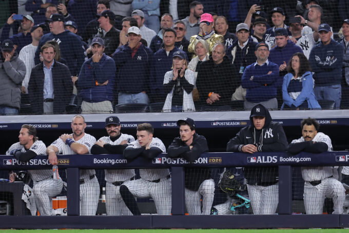 Oct 7, 2026; Bronx, New York, USA; New York Yankees third baseman Ryan McMahon (19) and first baseman Paul Goldschmidt (48) and catcher Austin Wells (28) and designated hitter Ben Rice (22) and starting pitcher Max Fried (54) and injured right fielder Aaron Judge (99) and center fielder Trent Grisham (12) watch from the dugout during the eighth inning of game three of the ALDS against the Tampa Bay Rays during the 2026 MLB Playoffs at Yankee Stadium.