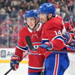 Oct 8, 2026; Montreal, Quebec, CAN; Montreal Canadiens forward Nick Suzuki (14) celebrates with teammate Montreal Canadiens defenseman Lane Hutson (48) after scoring a goal against the Nashville Predators during the second period at the Bell Centre. Mandatory Credit: Eric Bolte-Imagn Images