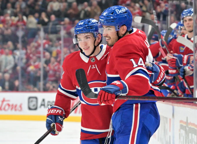Oct 8, 2026; Montreal, Quebec, CAN; Montreal Canadiens forward Nick Suzuki (14) celebrates with teammate Montreal Canadiens defenseman Lane Hutson (48) after scoring a goal against the Nashville Predators during the second period at the Bell Centre. Mandatory Credit: Eric Bolte-Imagn Images
