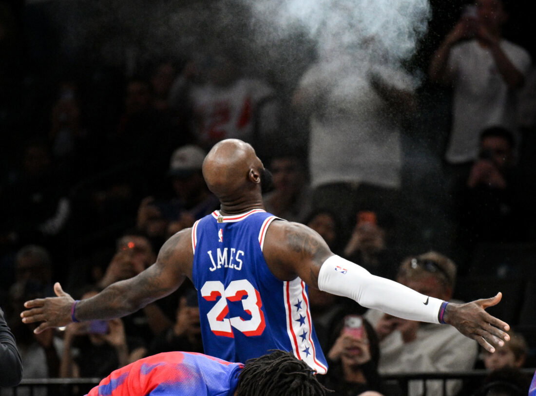 Oct 8, 2026; Brooklyn, New York, USA; Philadelphia 76ers forward Lebron James (23) tosses powder into the air before the start of the game against the Brooklyn Nets at Barclays Center. Mandatory Credit: John Jones-Imagn Images