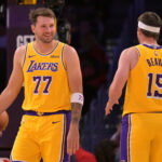 Oct 8, 2026; Los Angeles, California, USA; Los Angeles Lakers guard Luka Doncic (77) and guard Austin Reaves (15) on the court during the first half the Sacramento Kings at Crypto.com Arena. Mandatory Credit: Jayne Kamin-Oncea-Imagn Images