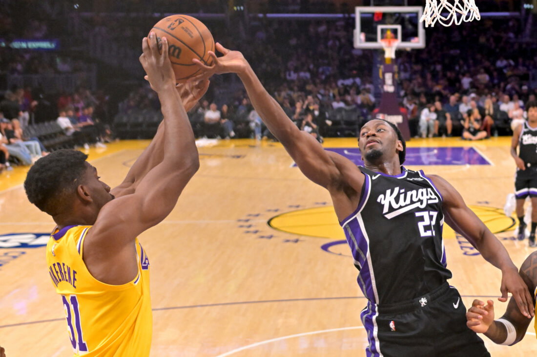 Oct 8, 2026; Los Angeles, California, USA; Los Angeles Lakers forward Ak Okereke (31) and Sacramento Kings forward Jonathan Mogbo (22) reach for a rebound at Crypto.com Arena. Mandatory Credit: Jayne Kamin-Oncea-Imagn Images