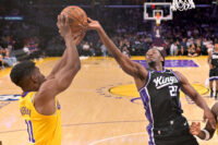 Oct 8, 2026; Los Angeles, California, USA; Los Angeles Lakers forward Ak Okereke (31) and Sacramento Kings forward Jonathan Mogbo (22) reach for a rebound at Crypto.com Arena. Mandatory Credit: Jayne Kamin-Oncea-Imagn Images
